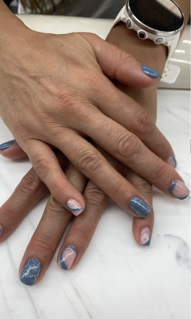 Denim blue glitter nails with swirl French tips
