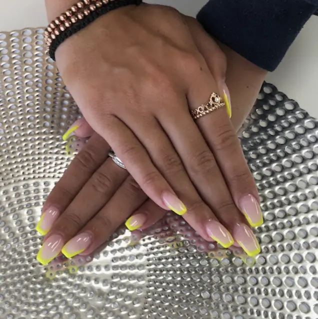 Neon yellow French tip coffin nails