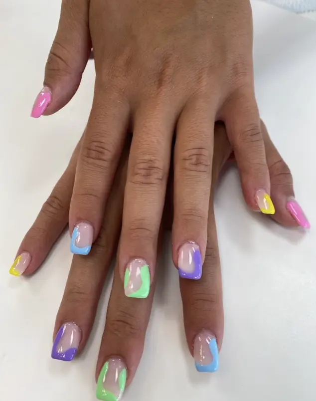 Pastel rainbow swirl French tip nails