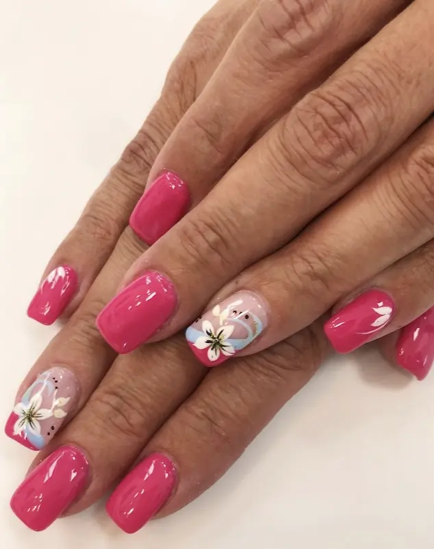 Hot pink gel nails with hand-painted white flower art